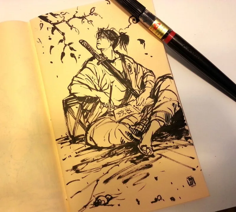 Desenho de samurai em um sketchbook aberto