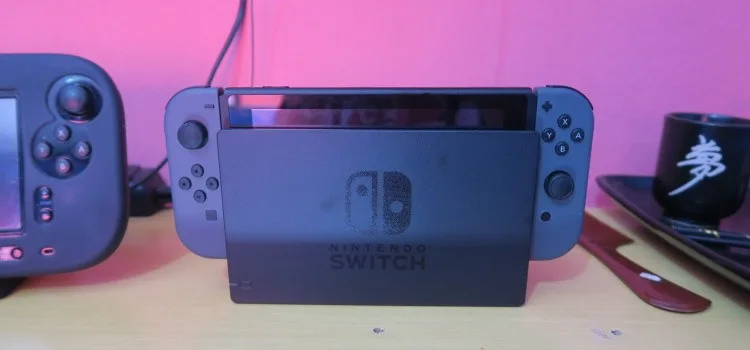 Biblioteca e proposta do Nintendo Switch Nintendo Switch com acessórios e foco em jogos