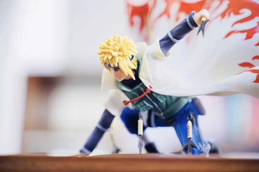 Mesa de festa temática de anime com decoração inspirada em Naruto Mesa de festa temática de anime com decoração inspirada em Naruto — balões, banner e petiscos personalizados