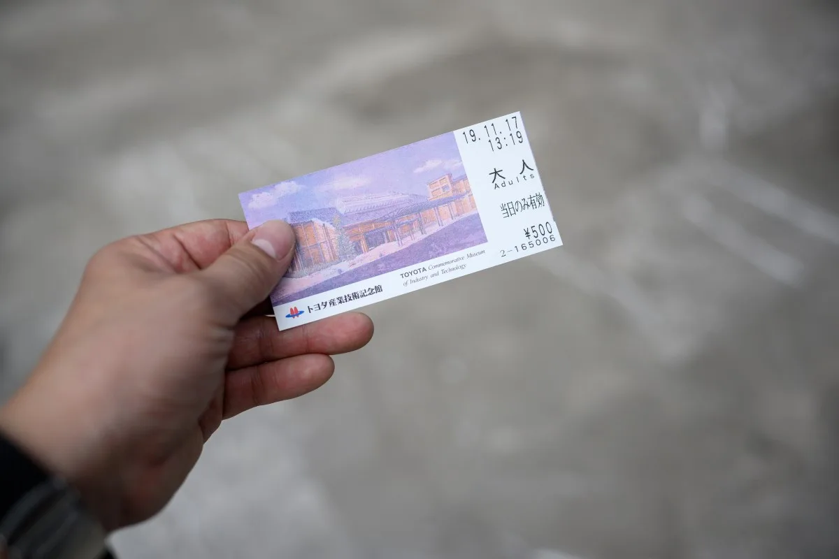 Nagoya / Japan Nov 26 2019 : The man holds the ticket to the Memorial Museum of Industry and Technology Toyota.