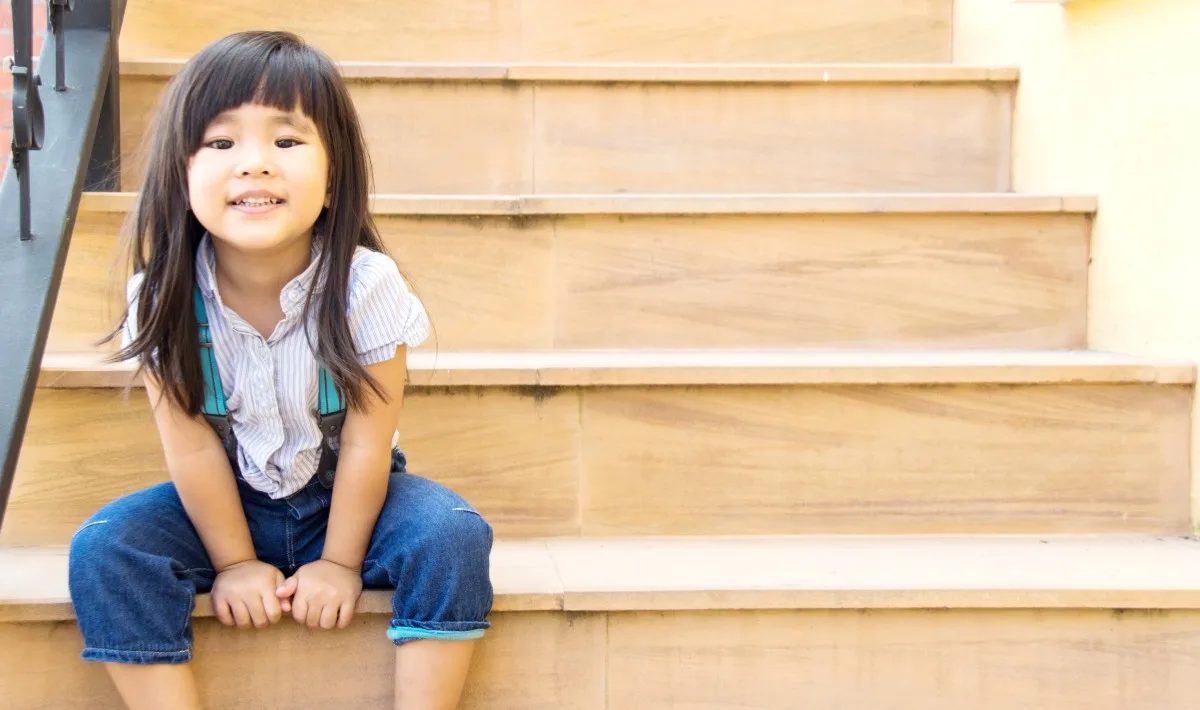 asian girl smile sitting on yellow stairs line