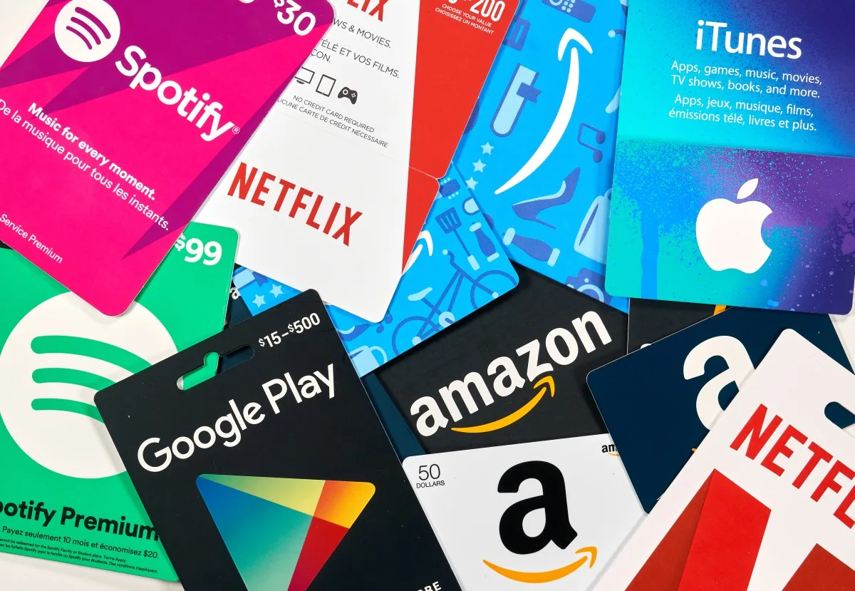 Montreal, Canada - April 6, 2020: Different gift cards of many brands such as Amazon, Netflix, Xbox, Google Play, Best Buy, Spotify. A gift card is a prepaid card that you use to pay for purchases