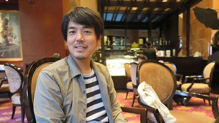 Portrait of Takanobu Nishimoto, the founder of the Ossan Rental service in Japan.